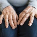 Senior woman suffering from arthritis